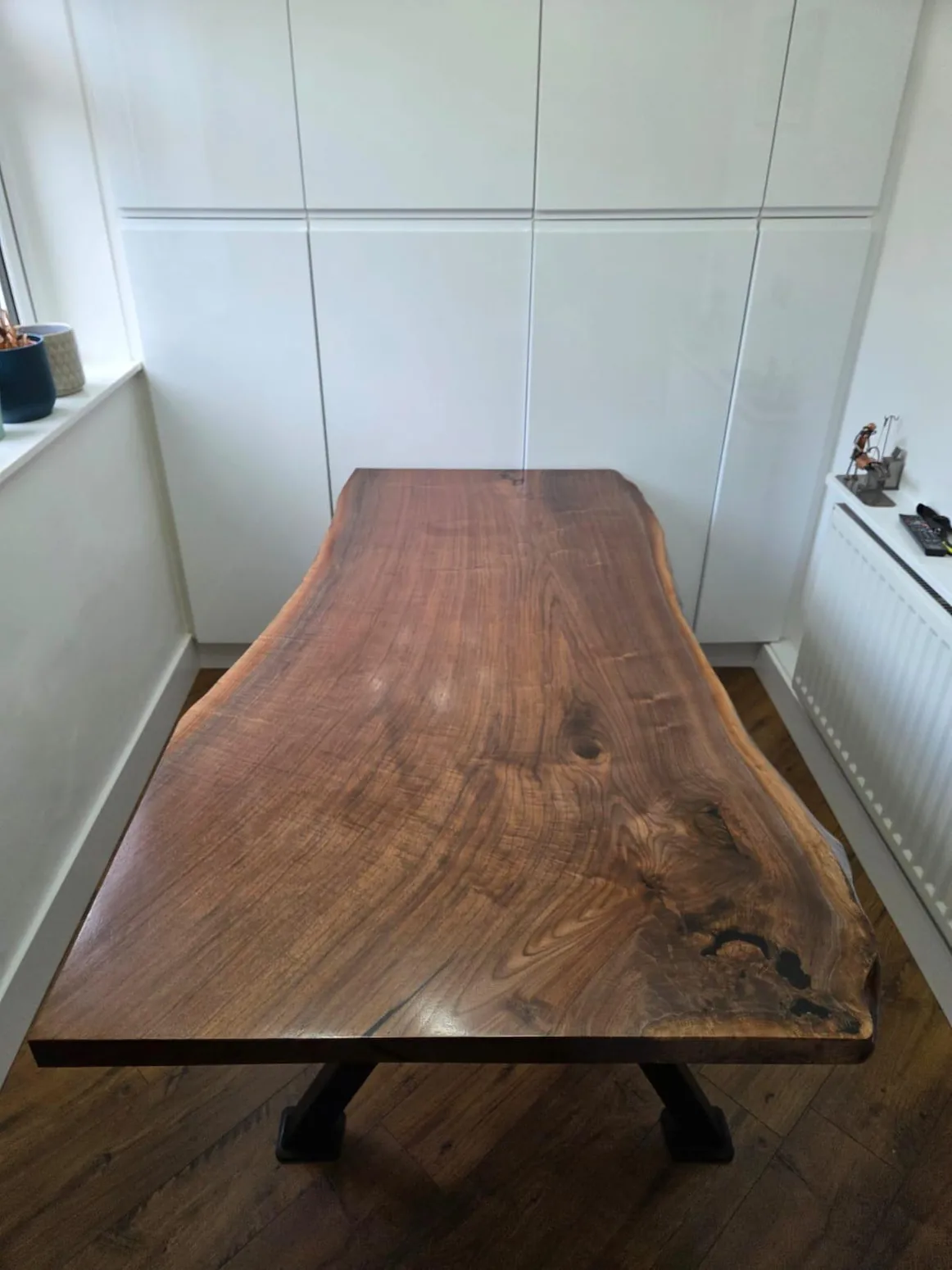 Solid timber bespoke table photographed in a finished room