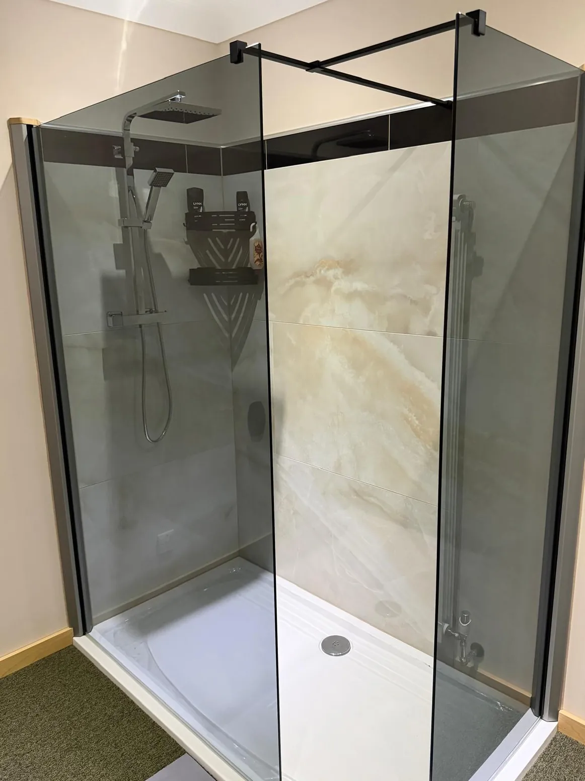 Bathroom with walk-in shower and tiled walls