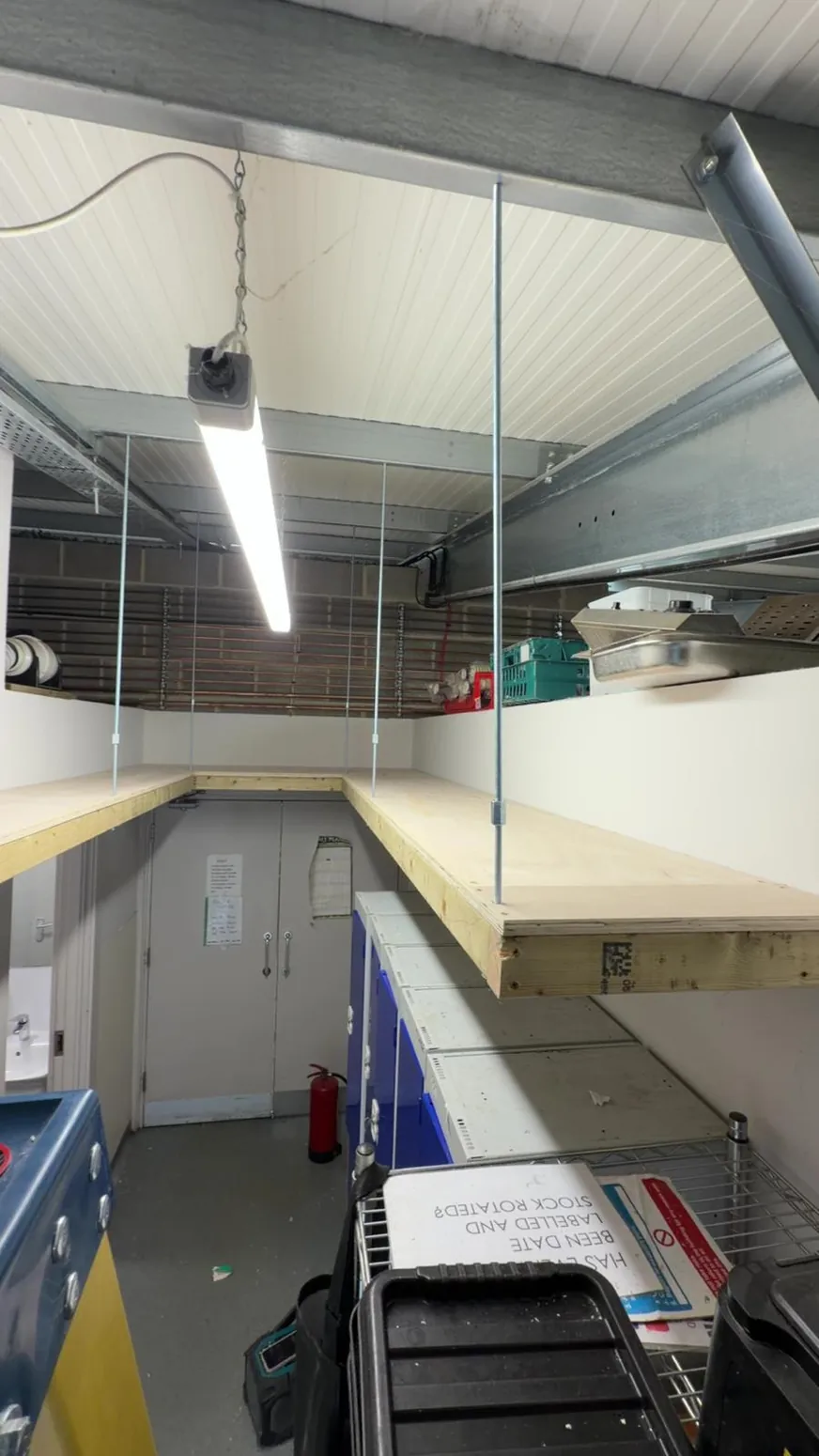 Commercial fitted counter and cabinetry workspace