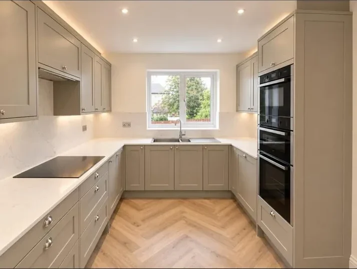Contemporary kitchen cabinetry, worktops and herringbone flooring