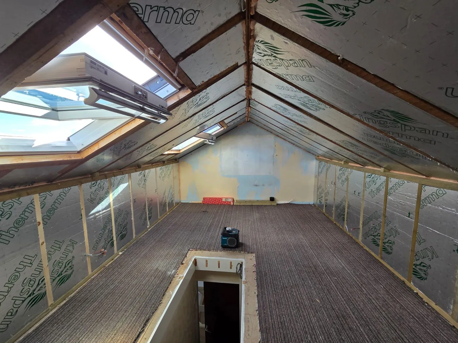 Open timber roof interior undergoing building work