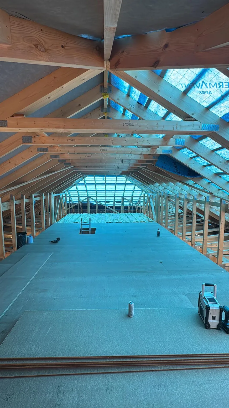 New timber framing and roof trusses under construction