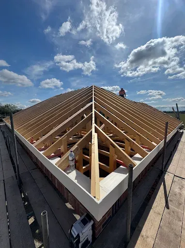 Precision cut pitched roof carpentry from above